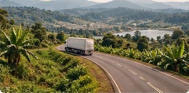 A truck on a road through East African farmland